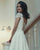 Short Satin Lace Wedding Dress with Cap Sleeves Illusion Back Elegant Bridal Gown with Pockets