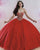 Strapless quinceanera ball gown with a sweetheart neckline, V-shaped beading patterns on bodice, basque waistline, shimmering tulle skirt, and lace-up back.